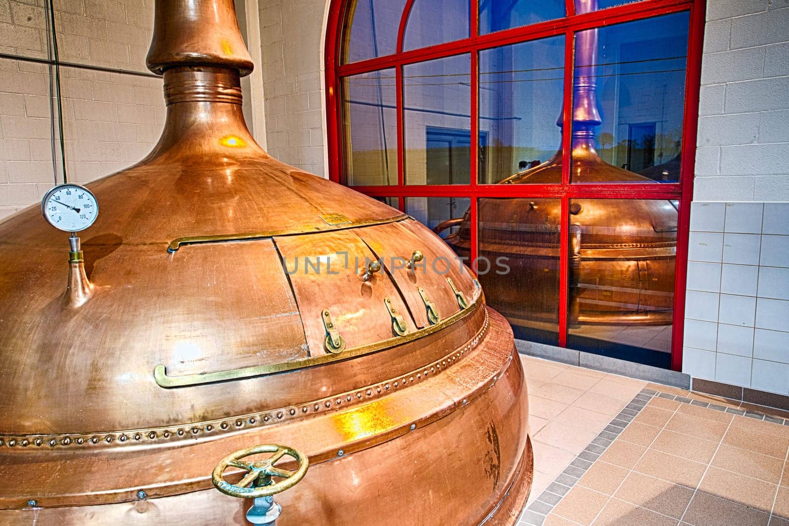Traditional copper distillery tanks in a beer brewery