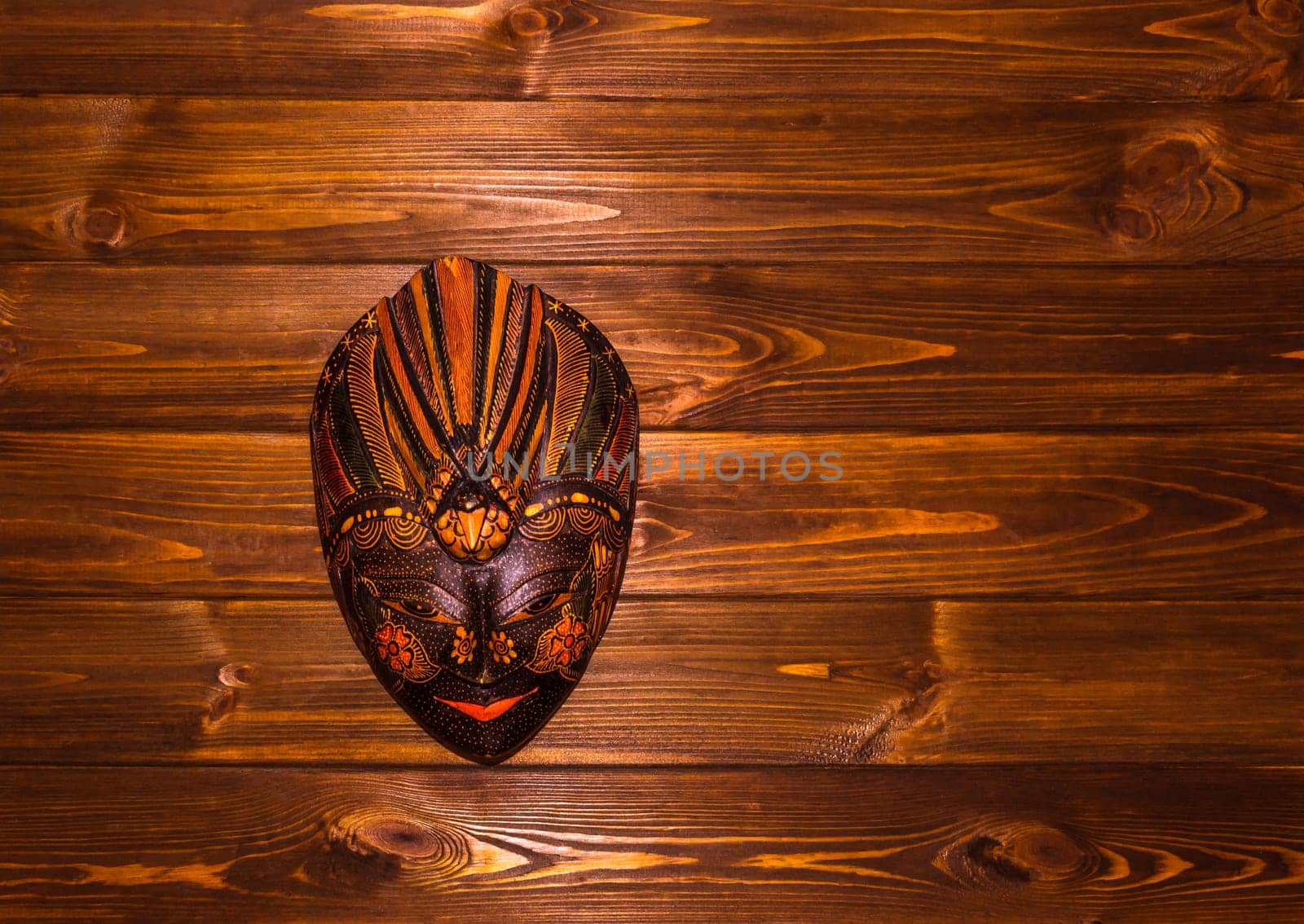 Traditional Indonesian mask, Baliness, on wooden background