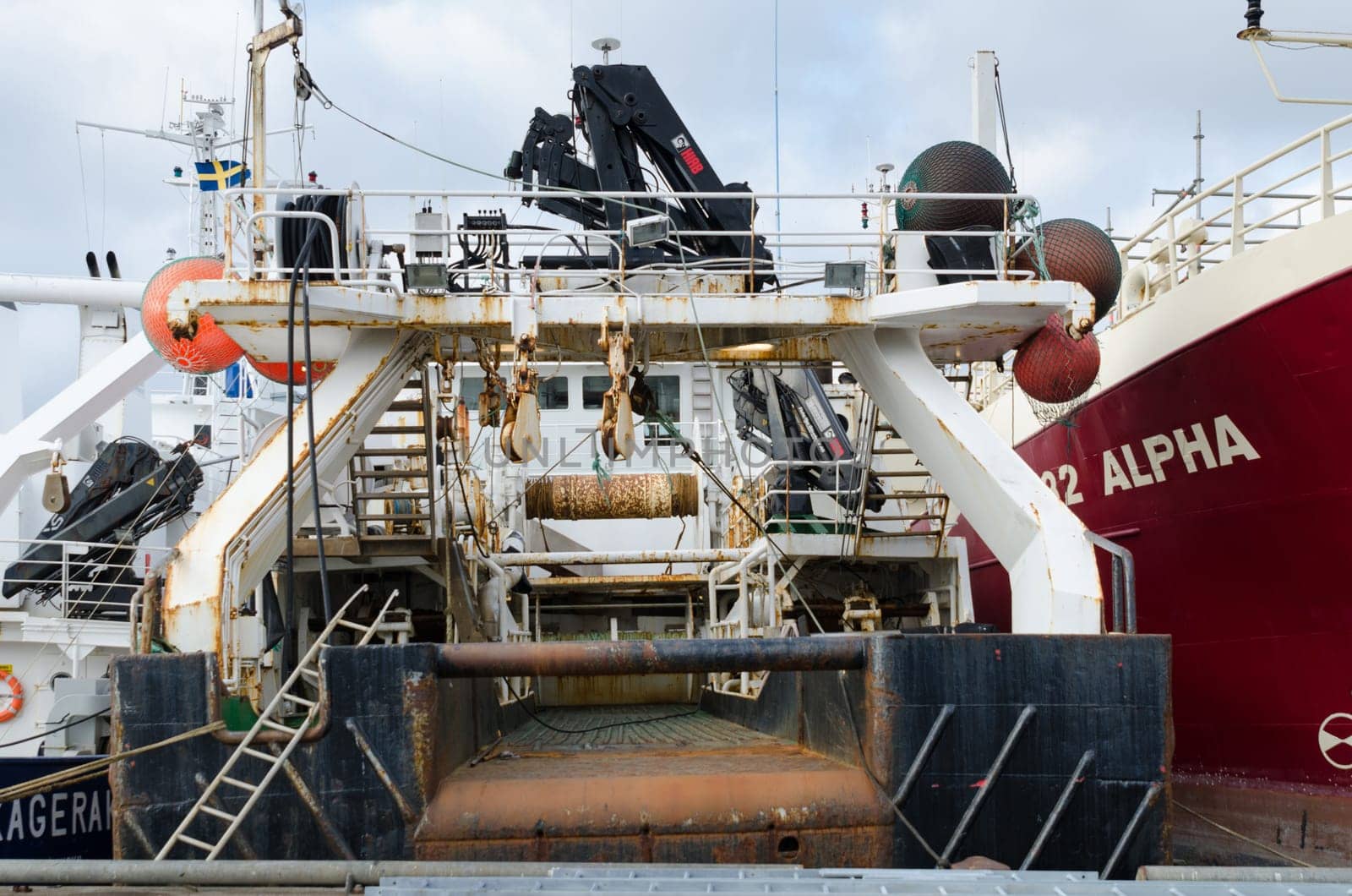 back of a big fishingboat in the harbour ready to go out to the ocean