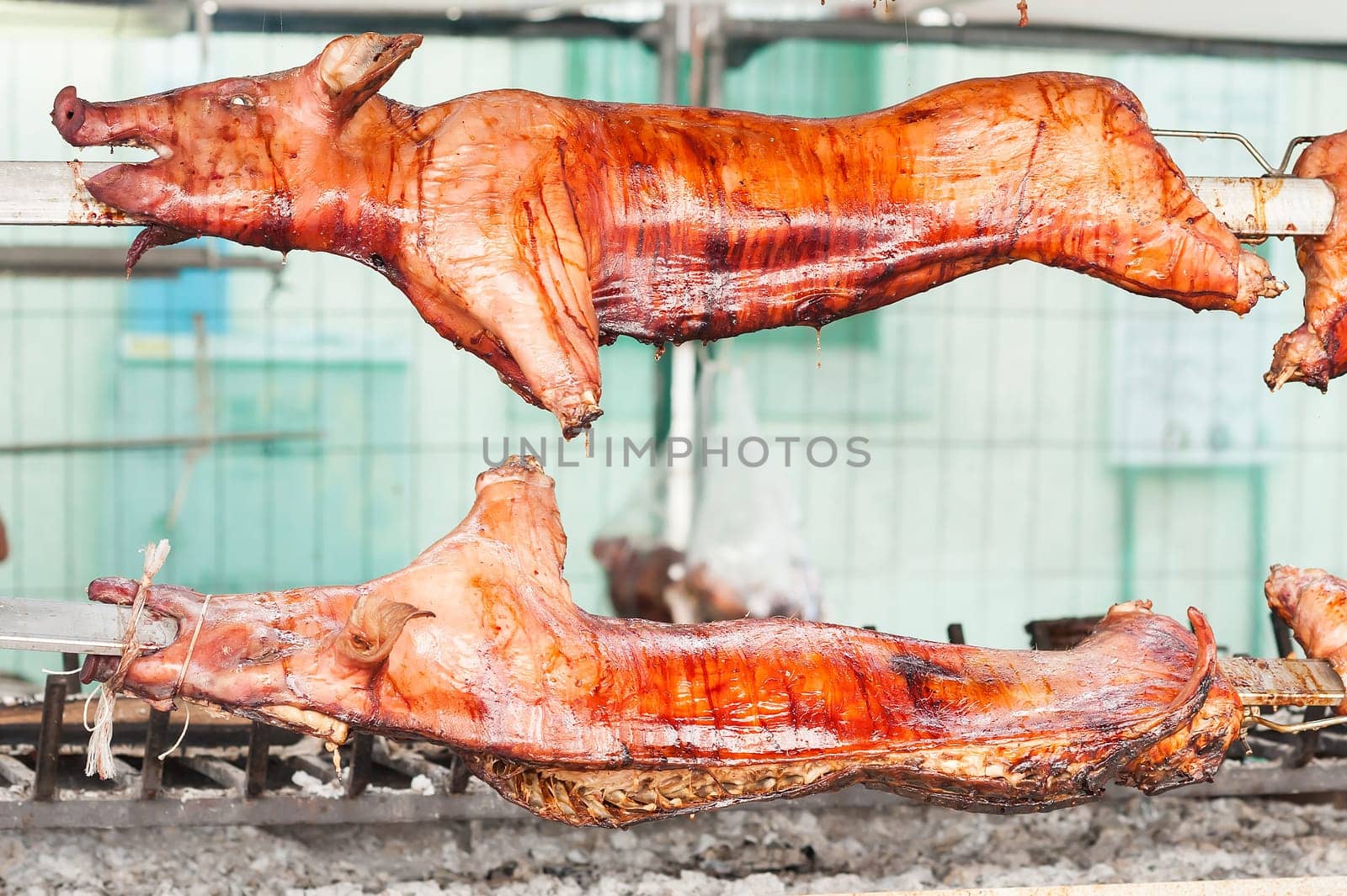 Baked roasted pork carcasses on the barbecue.