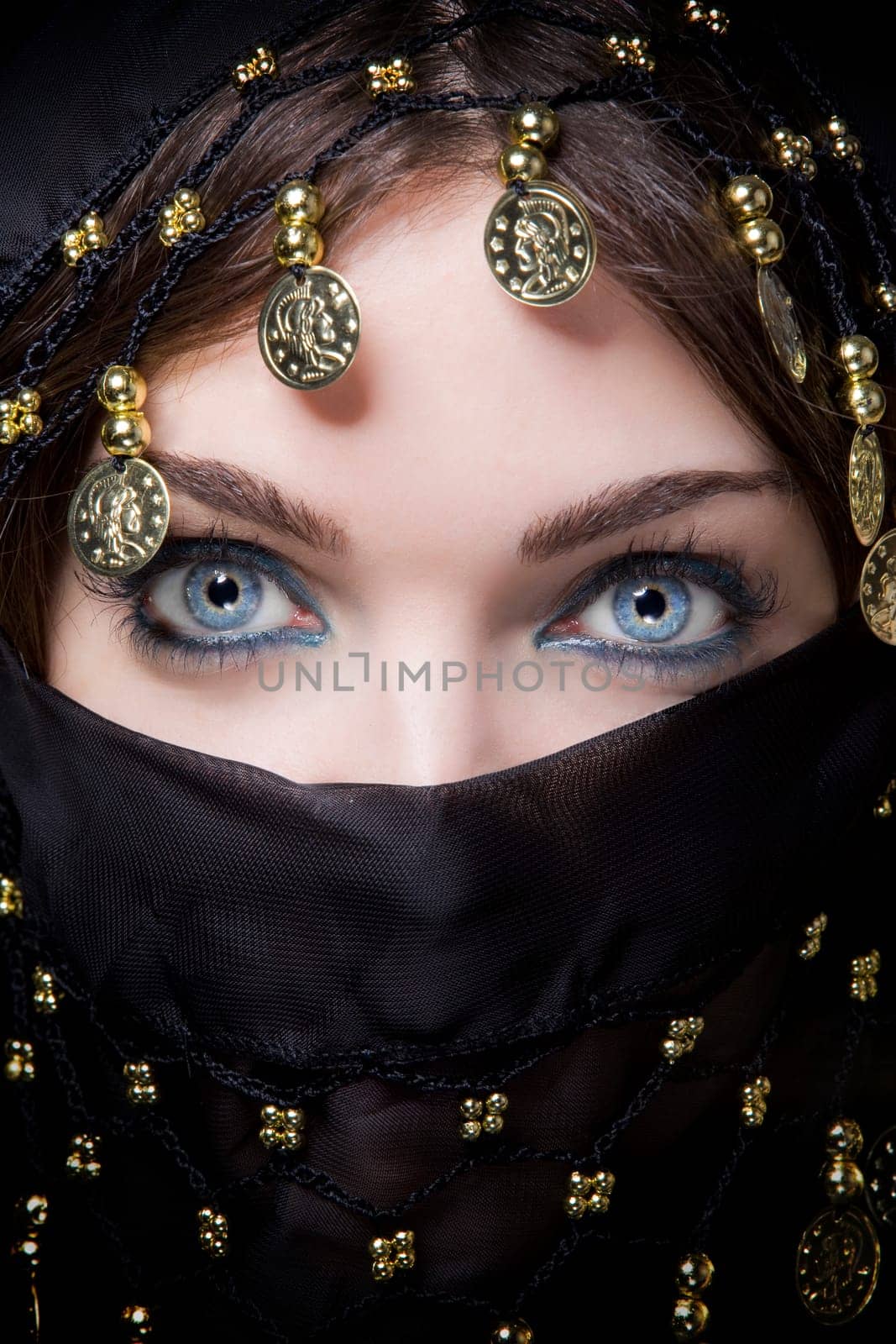 oriental blue eyed female with a scarf