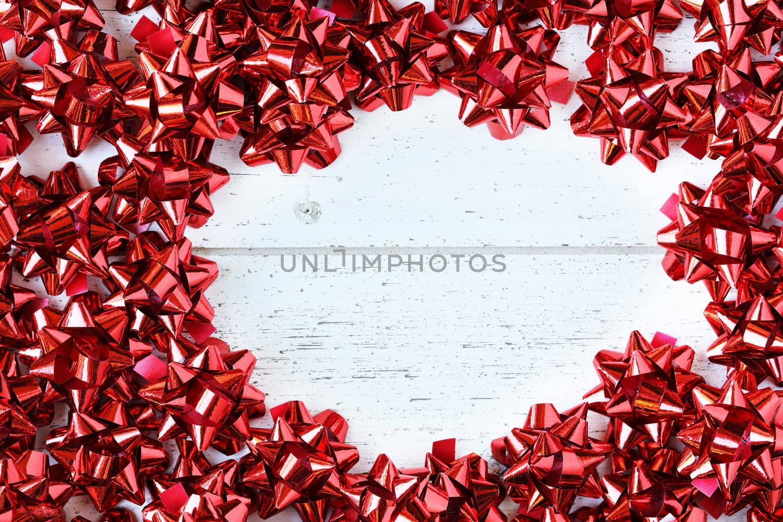 Many red decorative bows for Christmas or other gifts, with copy space.