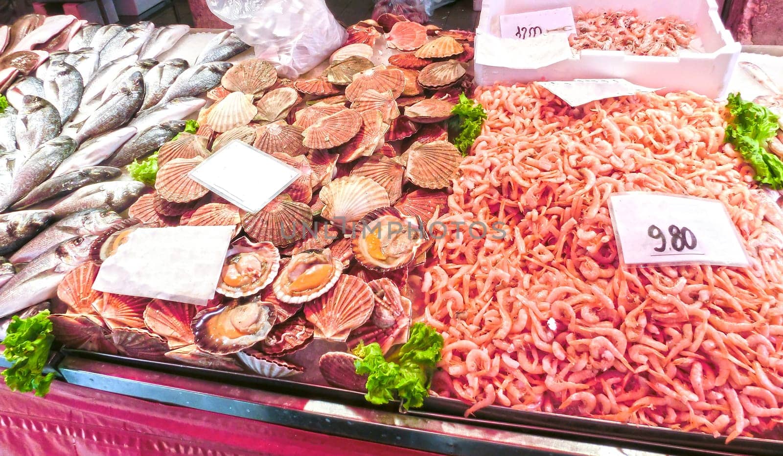 Venetian fish market - fish and prawns. The Rialto fish market is located alongside the Grand Canal near the Rialto Bridge - Venice, Italy