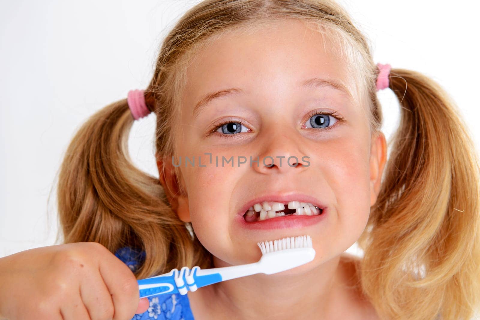 little funny girl with space width and toothbrush