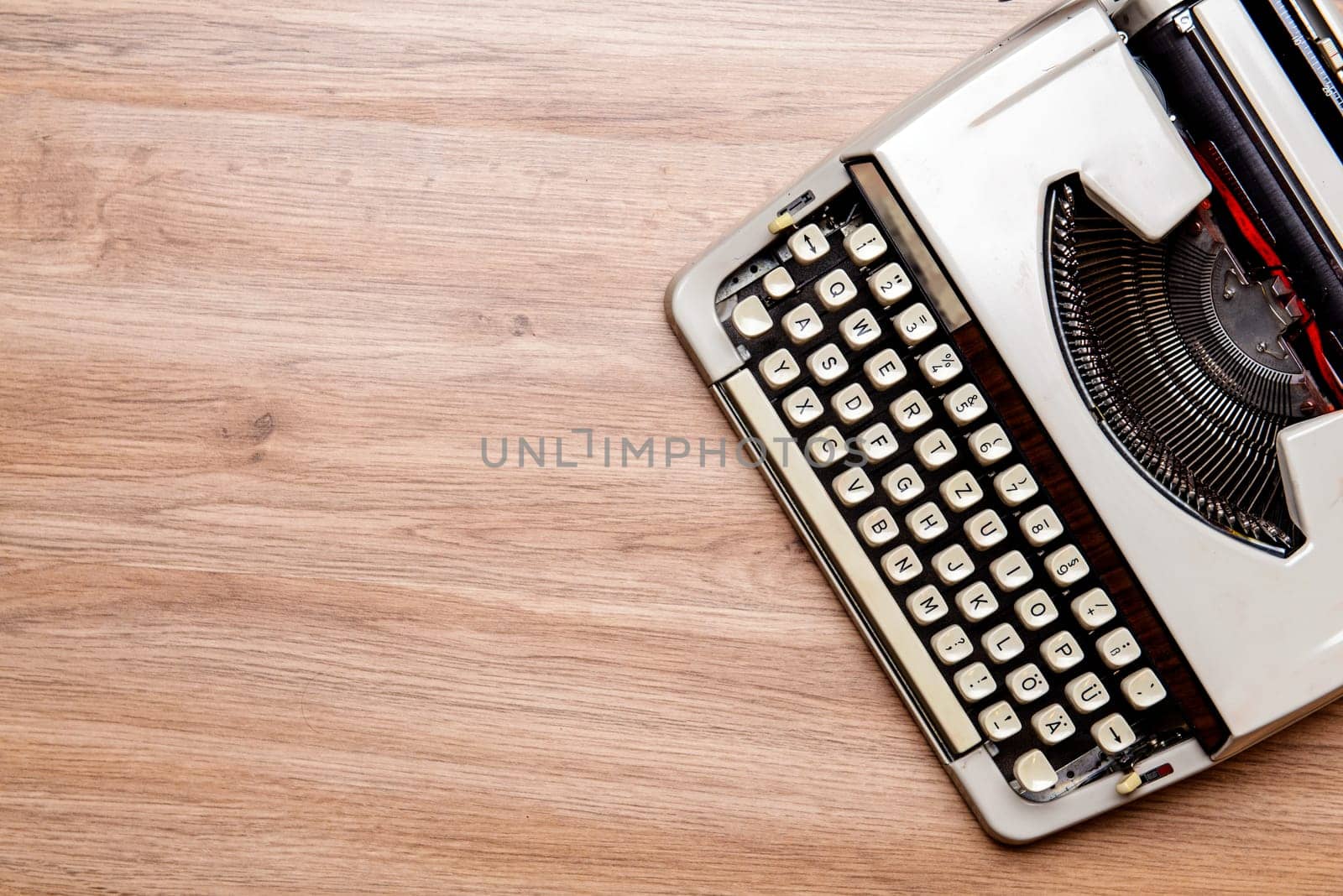 old typewriter on wooden ground from above