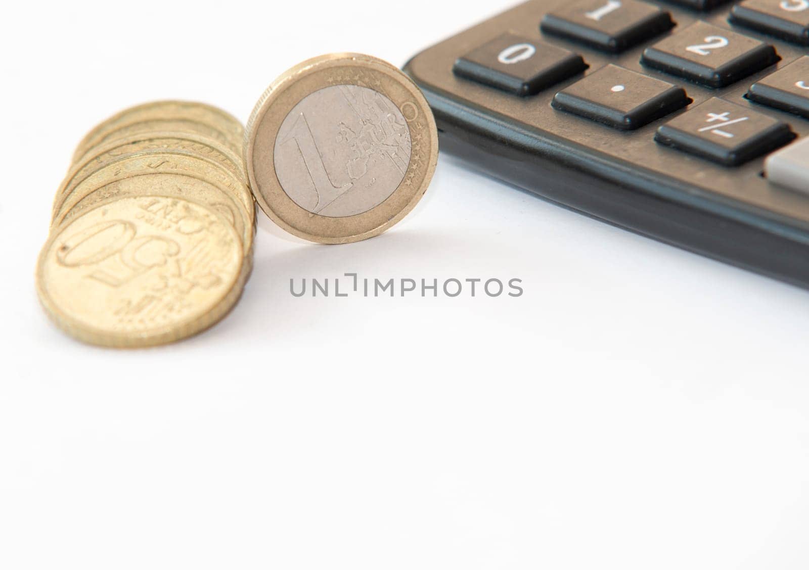 close up of euro currency. coins,banknotes and calculator