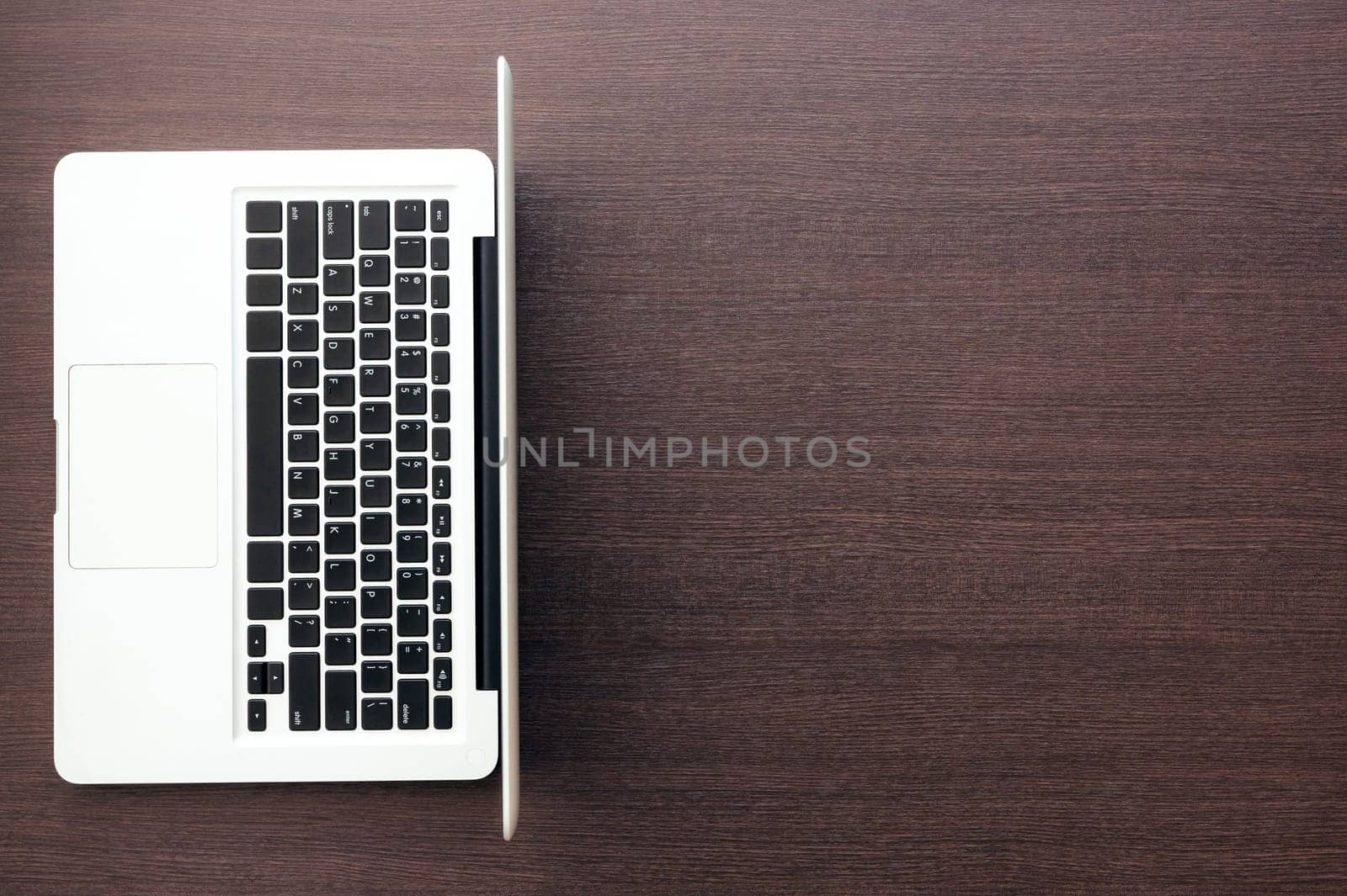 laptop computer with blank space on wood desk top view