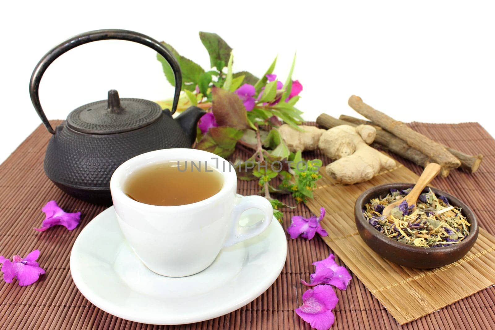 a cup of herbal tea and Chinese medicinal herbs