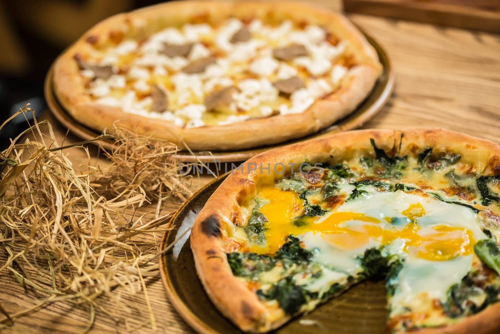 Margarita pizza with arugula and egg for breakfast, selective focus