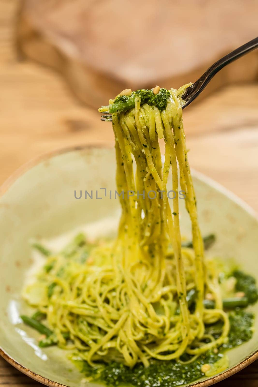Italian pasta with pesto sauce close-up. Shallow dof.