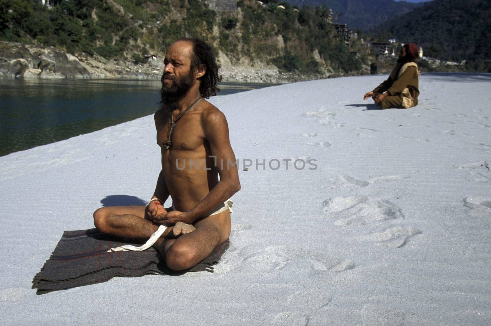 two men on the Ganges River in the town of Rishikesh in the Province Uttar Pradesh in India.