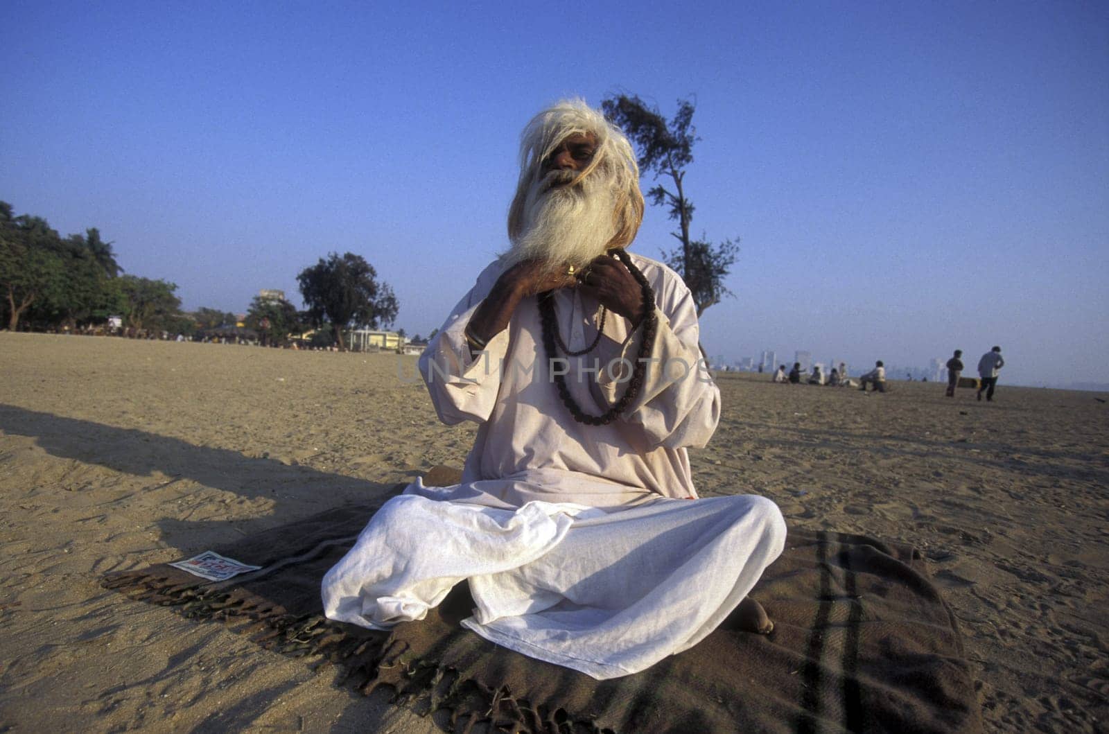 a Saddhu on the Chowpatty Beach in the city of Mumbai in India.
