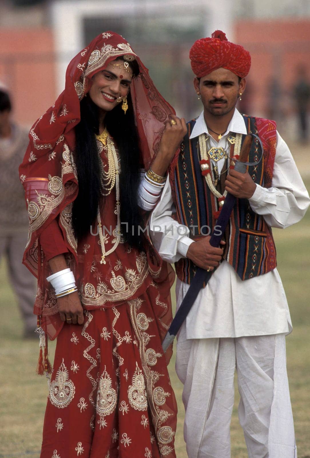 a couple,a men is dresst a women,at the kamel Festival in the town of Bikaner in the province Rajasthan in India.