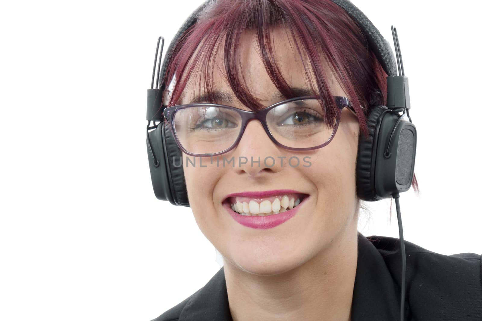 portrait of a beautiful young woman with headphones and glasses