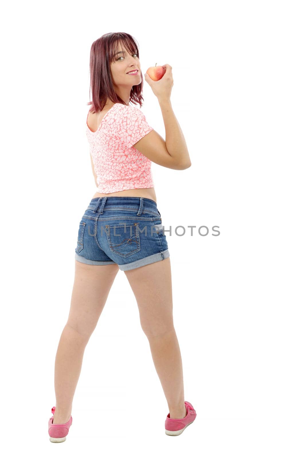 beautiful pretty young woman in pink shirt and denim shorts, back view