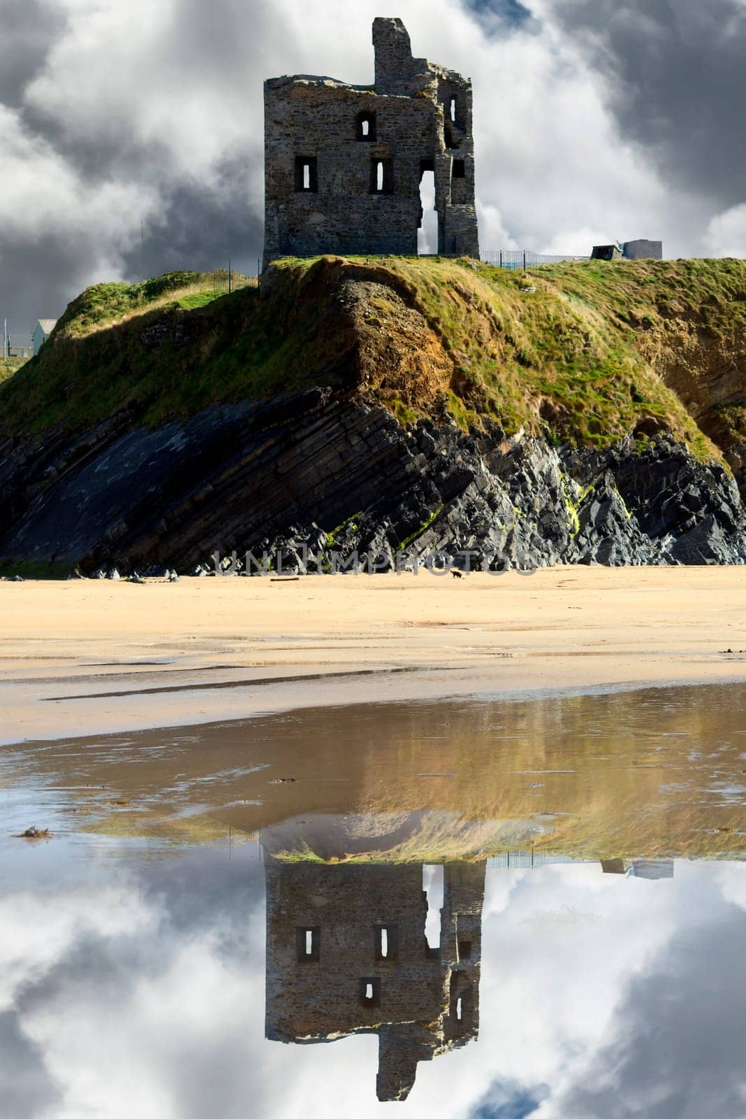 wild atlantic way castle and beach with beautiful reflections