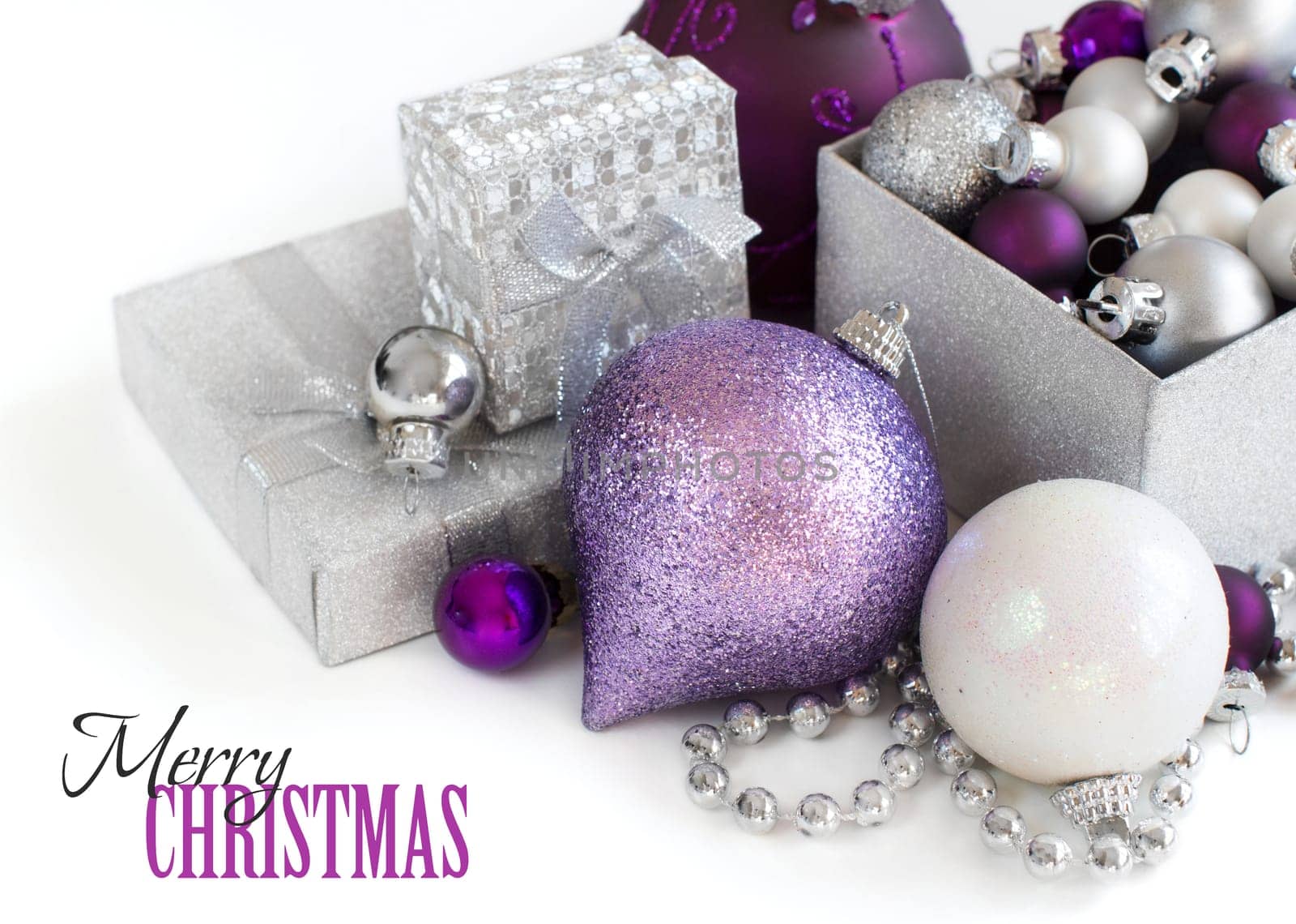 Silver and purple Christmas ornaments border on white background