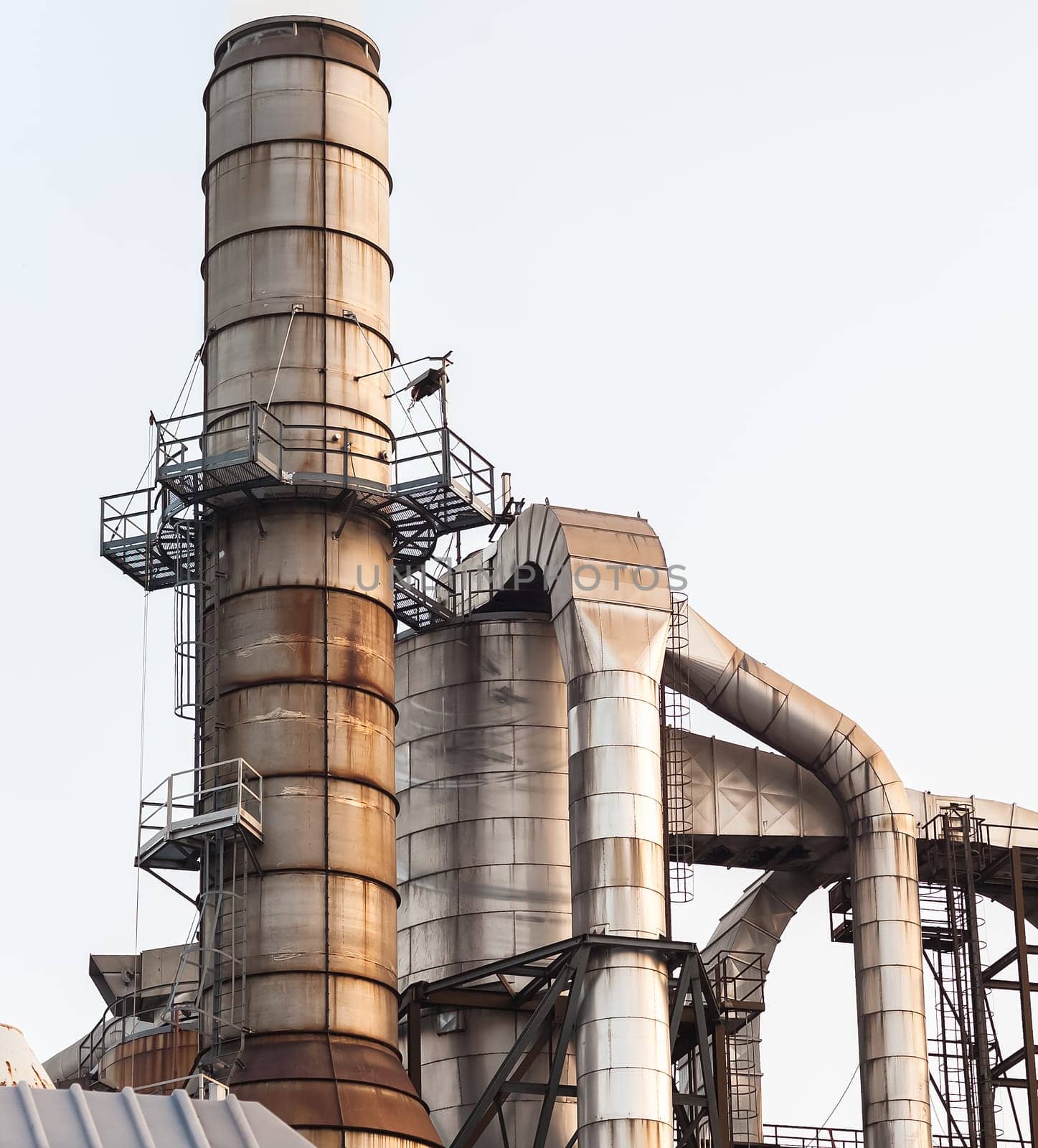 Chemical plant. Silos and smokestacks of a factory.