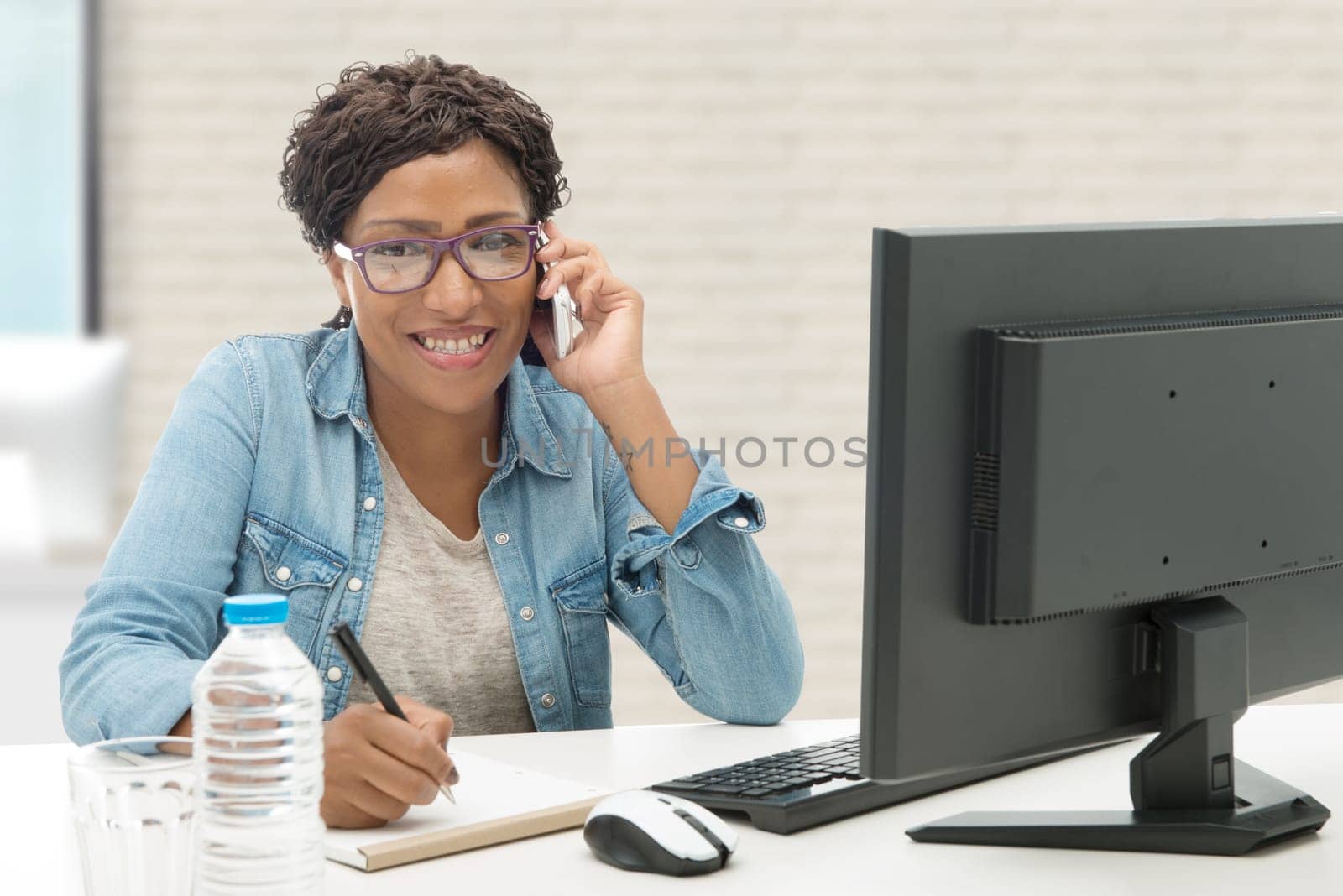 an african american business woman  on phone