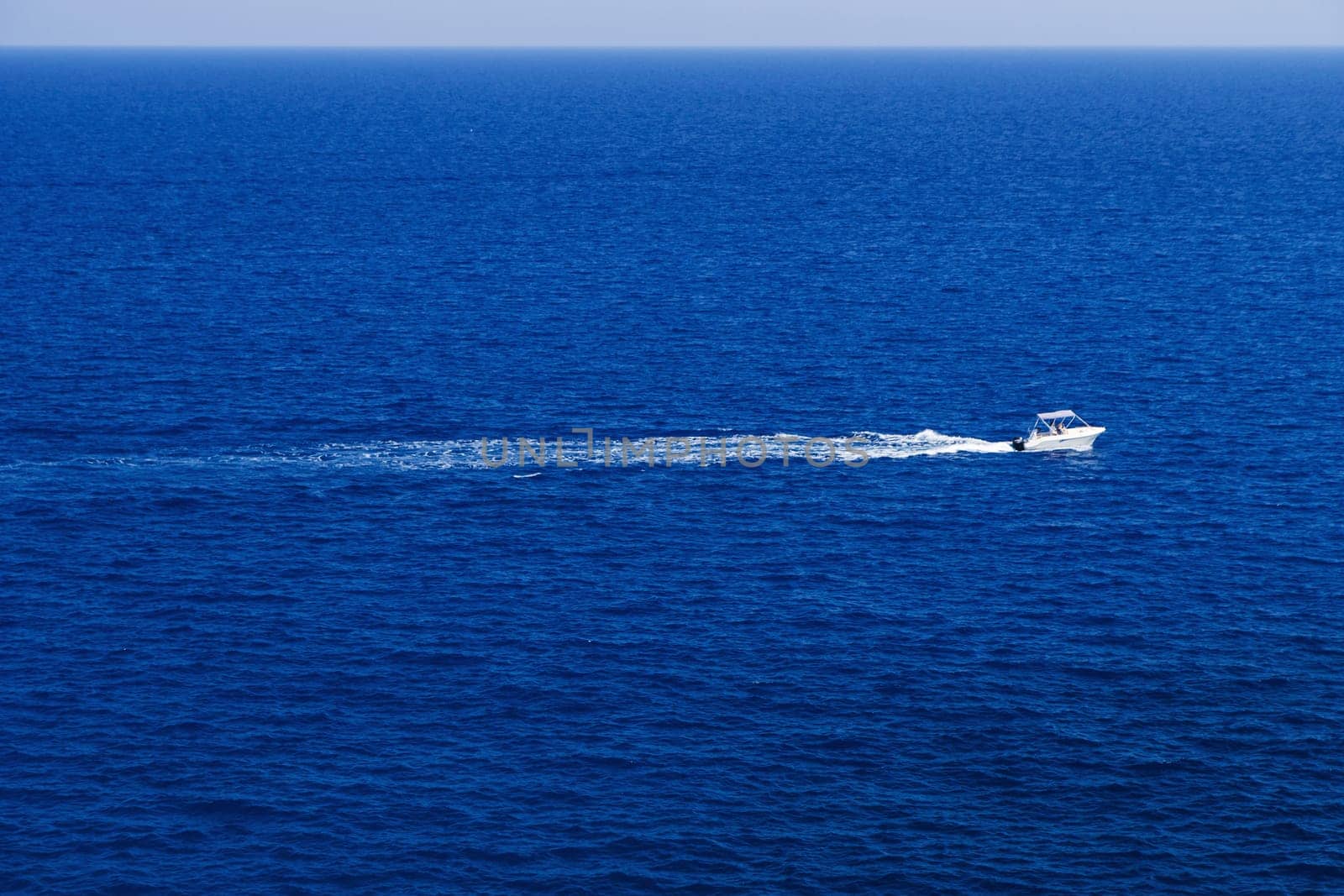 Fast motor boat with splash and wave.