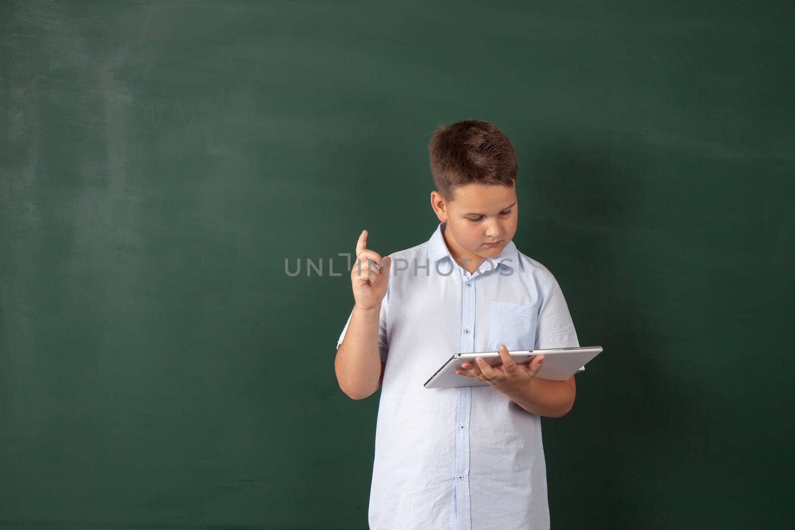 boy in a shirt with school boards