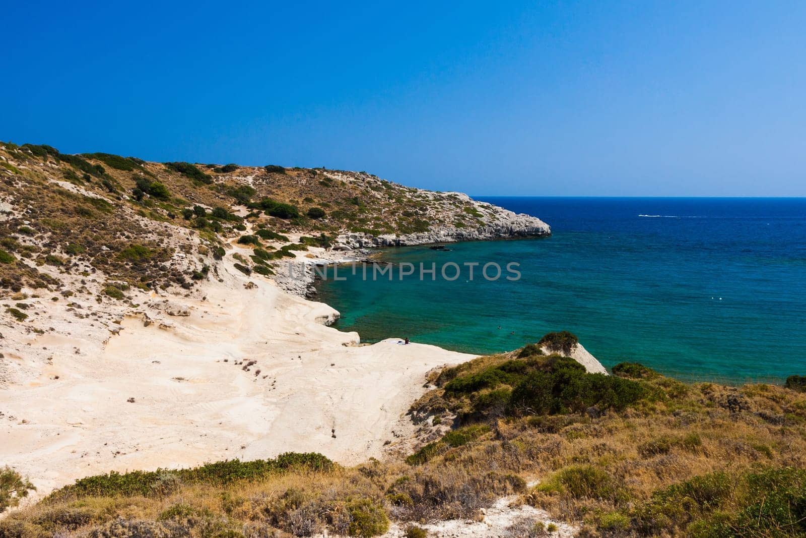 Kolymbia beach with the rocky coast in Greece.