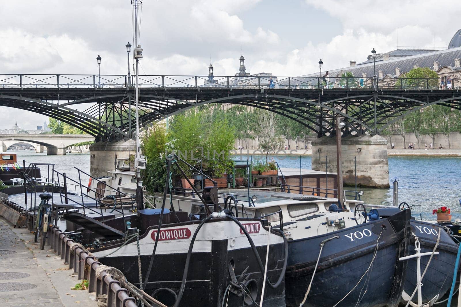 cargo ships on seine river near the pont des arts