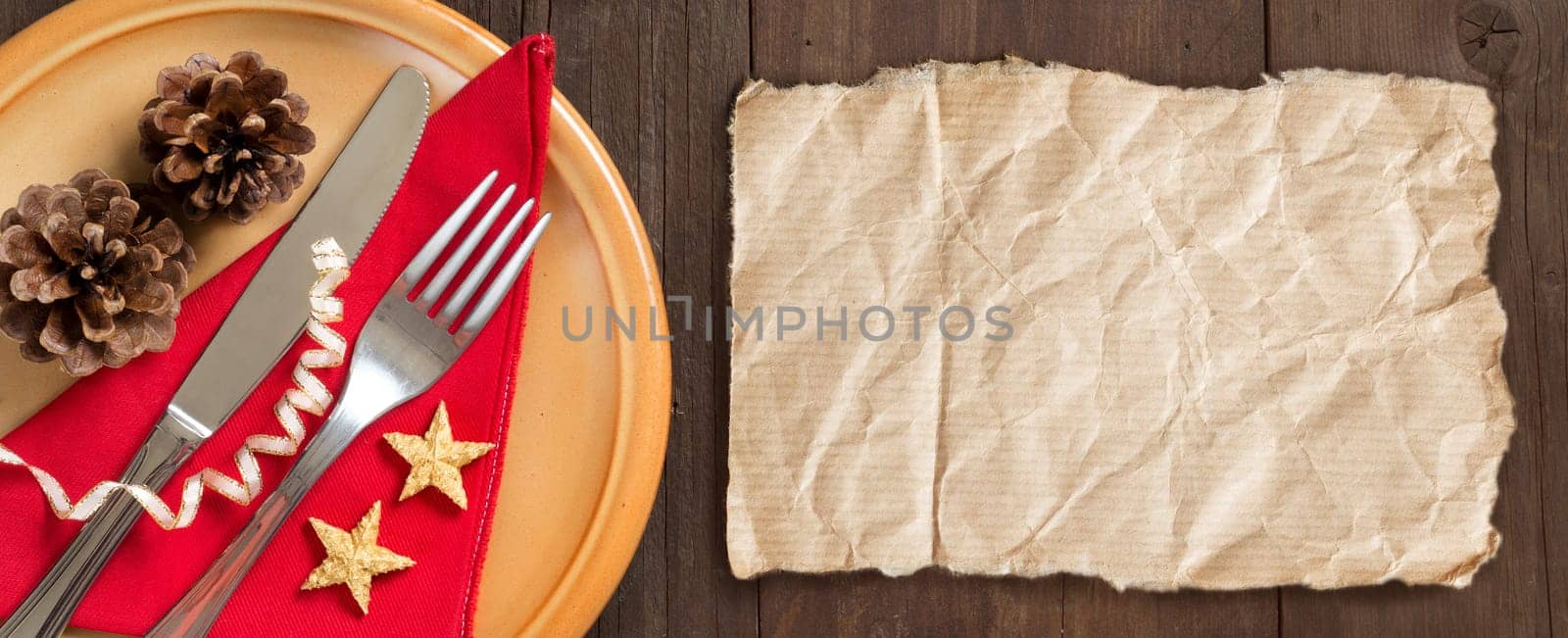 Festive table setting with craft paper on wooden table