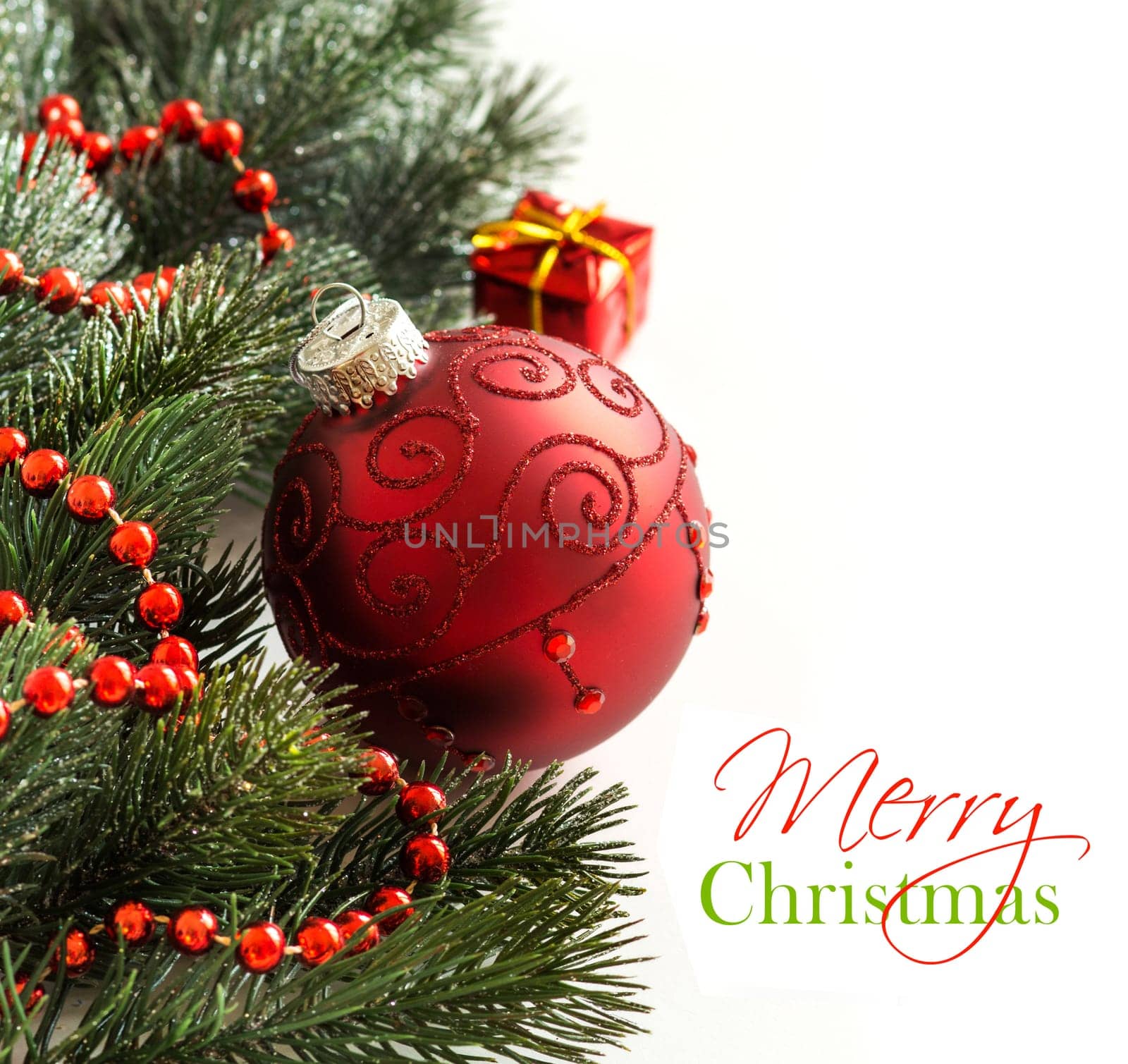 Festive decoration with red bauble and garland