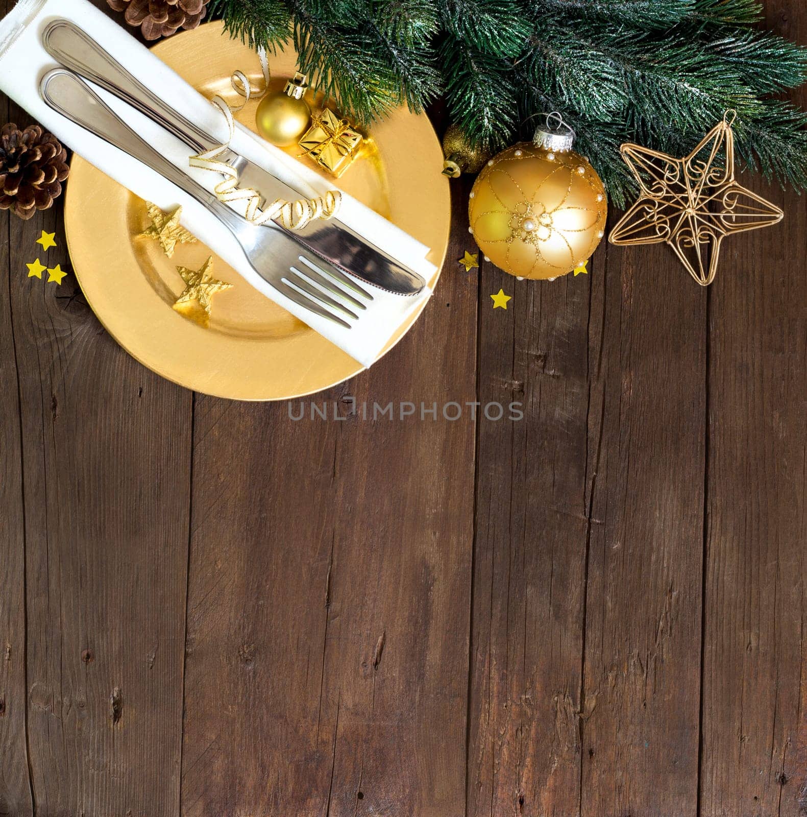 Festive table setting with Christmas decorations on wooden table
