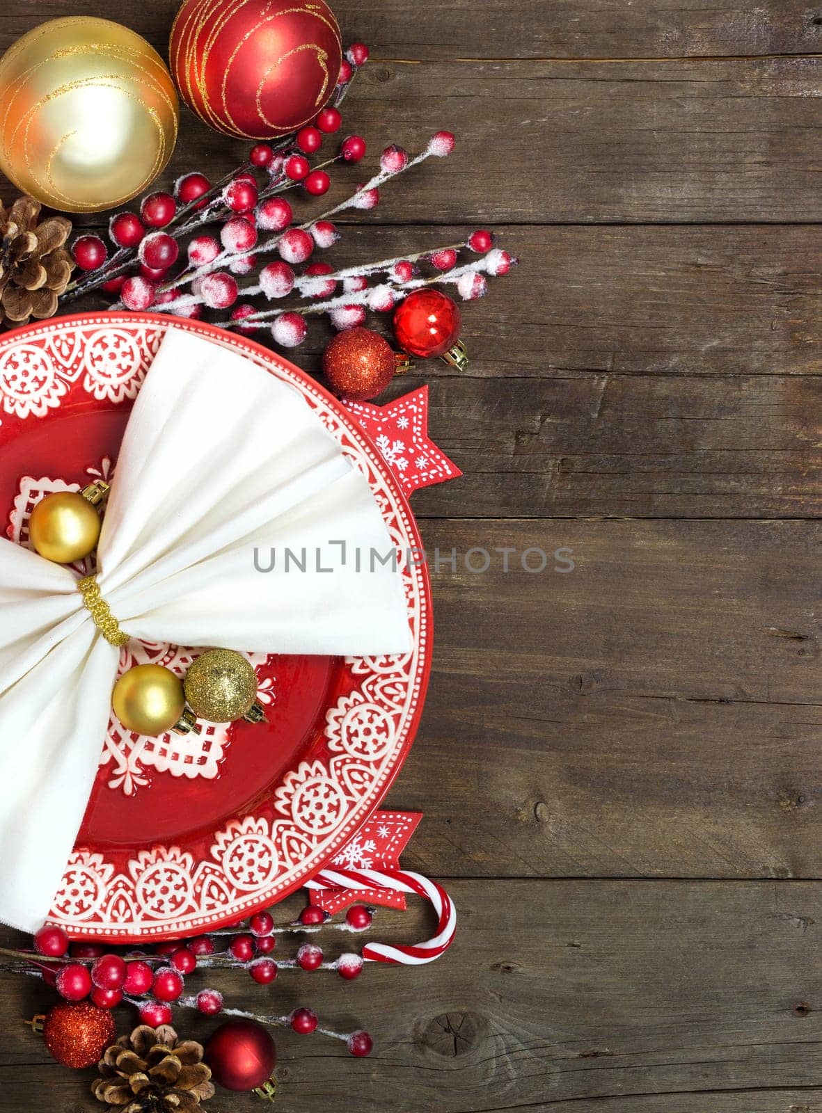 Festive table setting with Christmas decorations on wooden table