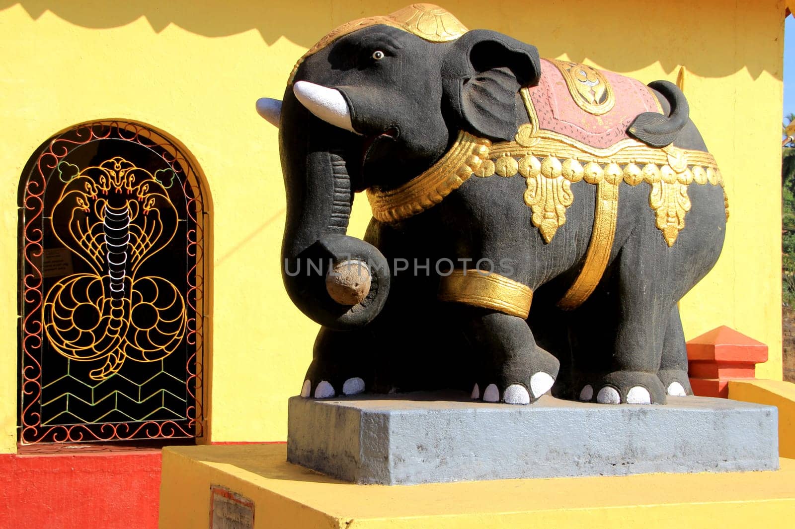 Bright, painted, cement elephant at Kudupu Shri Ananthapadmanabhaswami Temple, Mangalore, Karnataka, India, Asia