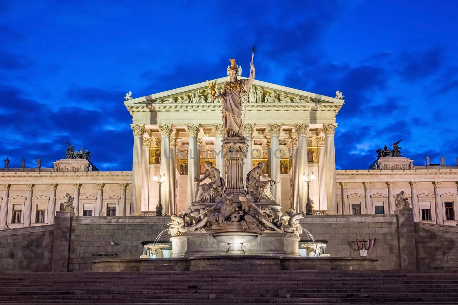 Pallas Athene fountain at night,illuminated landmark in front of the Austrian Parliament