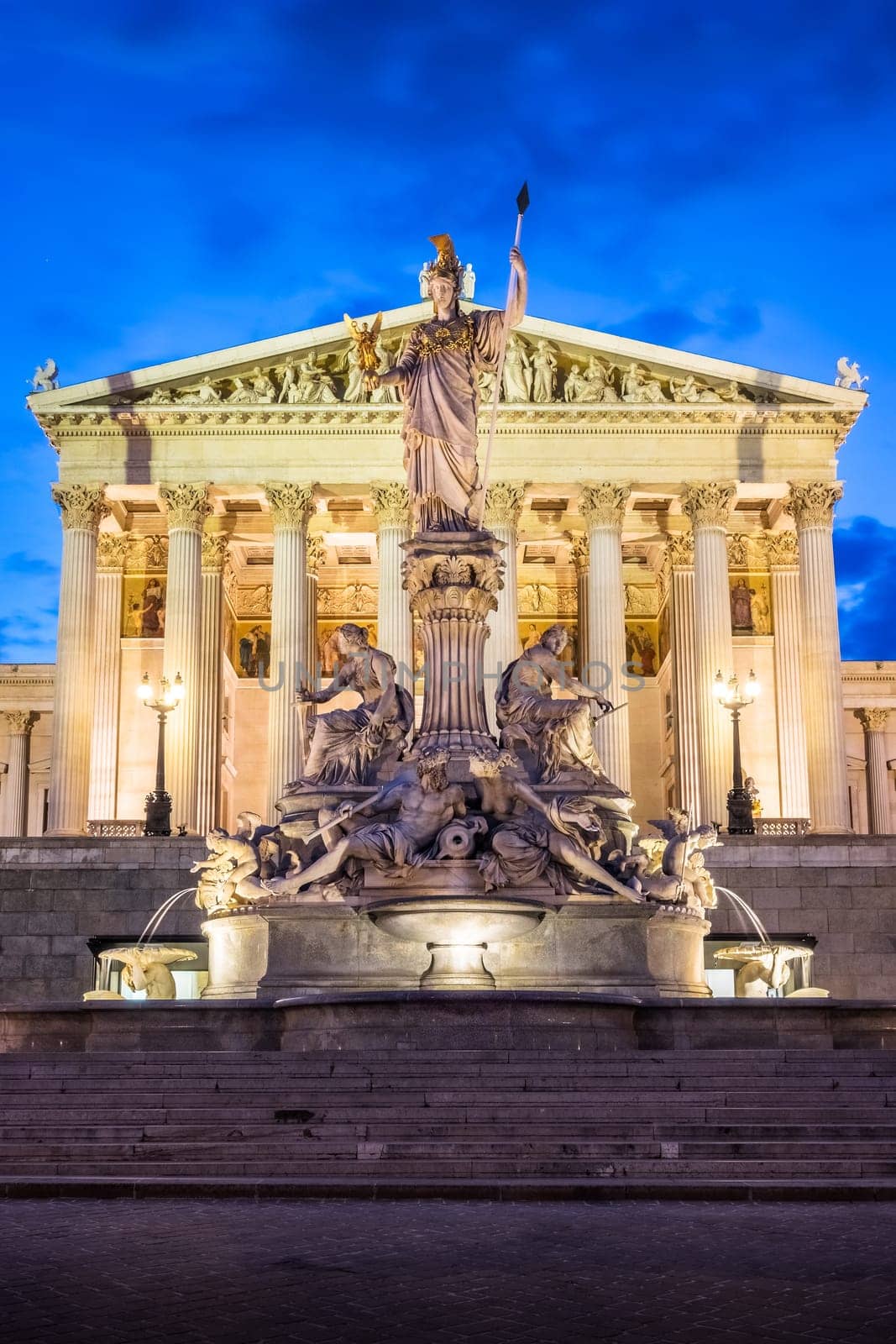 Pallas Athene fountain at night,illuminated landmark in front of the Austrian Parliament