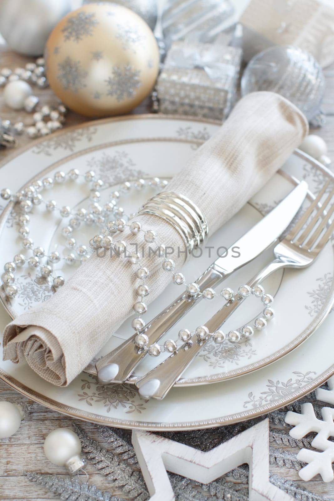 Silver and cream Christmas Table Setting with christmas decorations