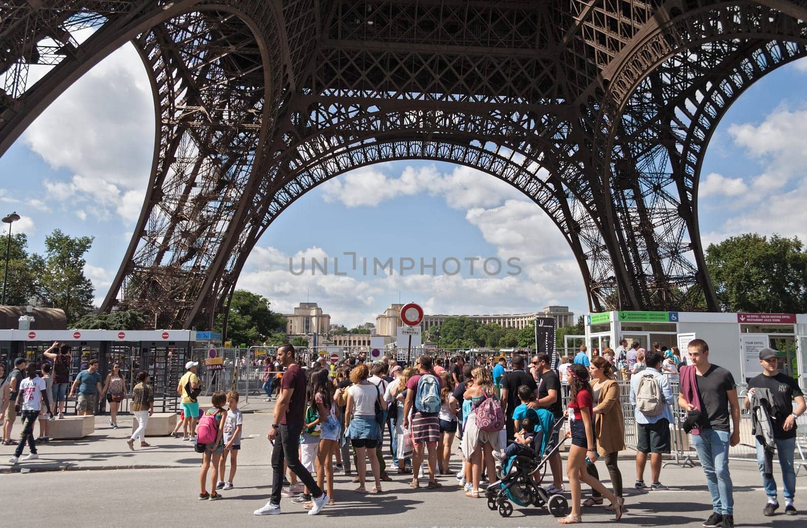 tourists at the Eiffel Tower in Paris