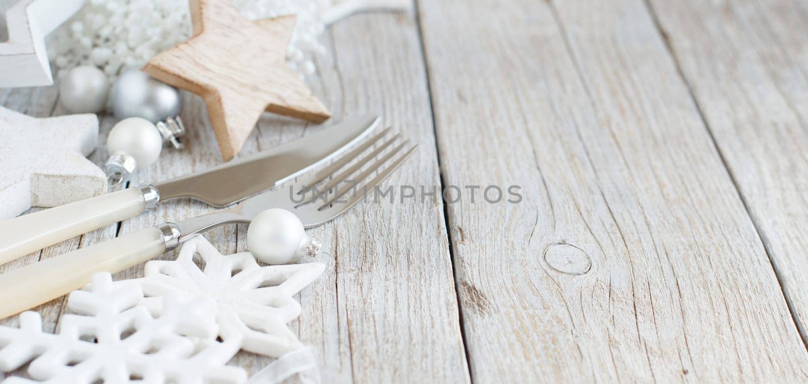 Silver and cream Christmas Table Setting with christmas decorations