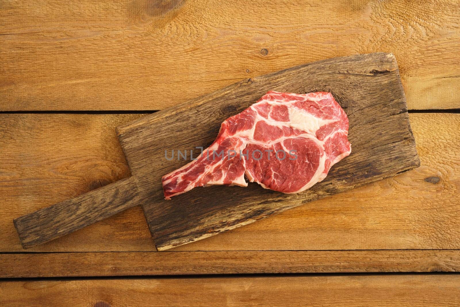 Dry aged Rib eye steak on wooden board
