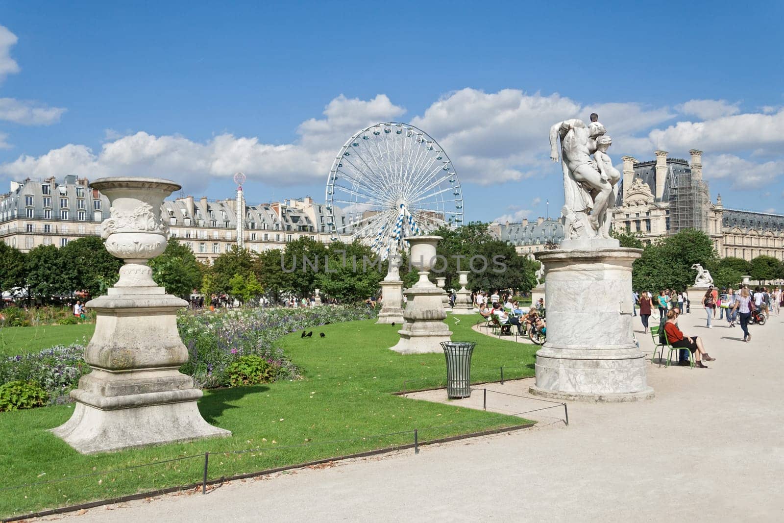 Parisians and tourists in Tuileries garden (Jardin des Tuileries)