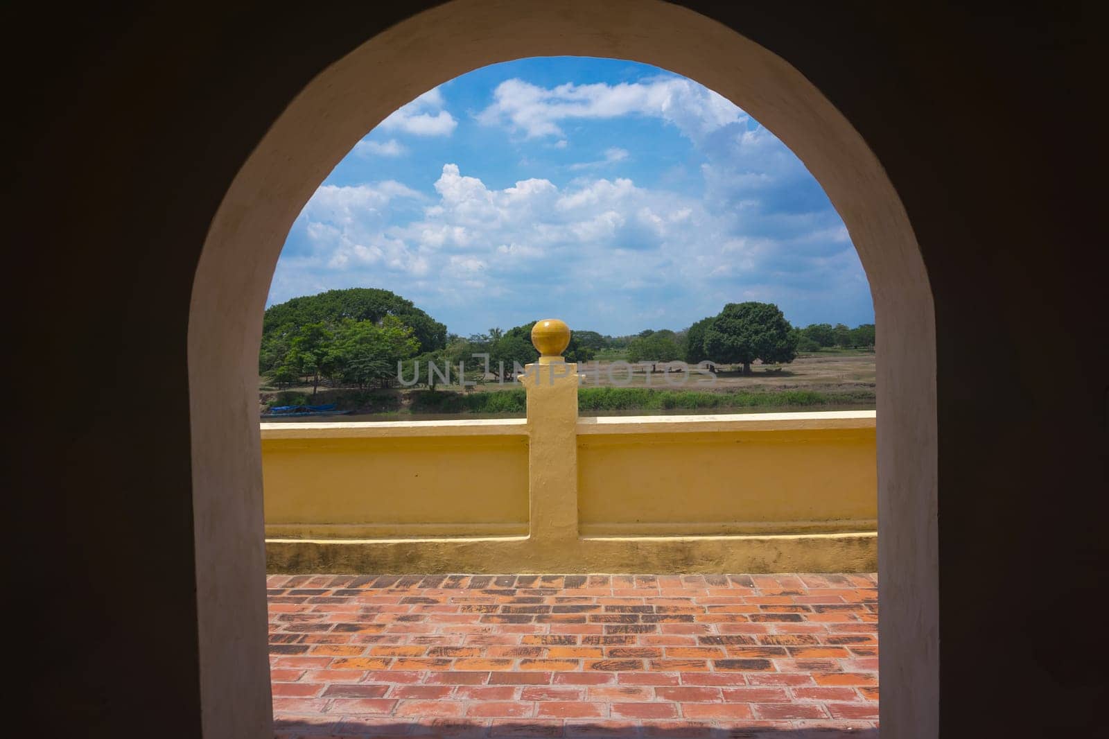 Landscape in Mompox, Colombia viewed through an arch in the historic town market