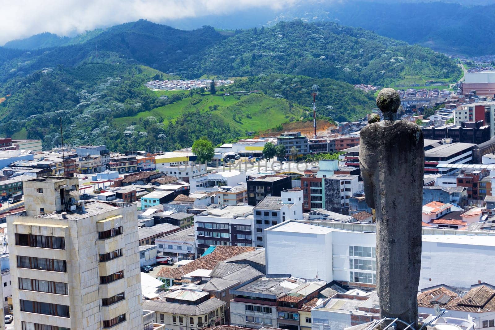 Statue on the basilica overlooking the city of Manizales, Colombia