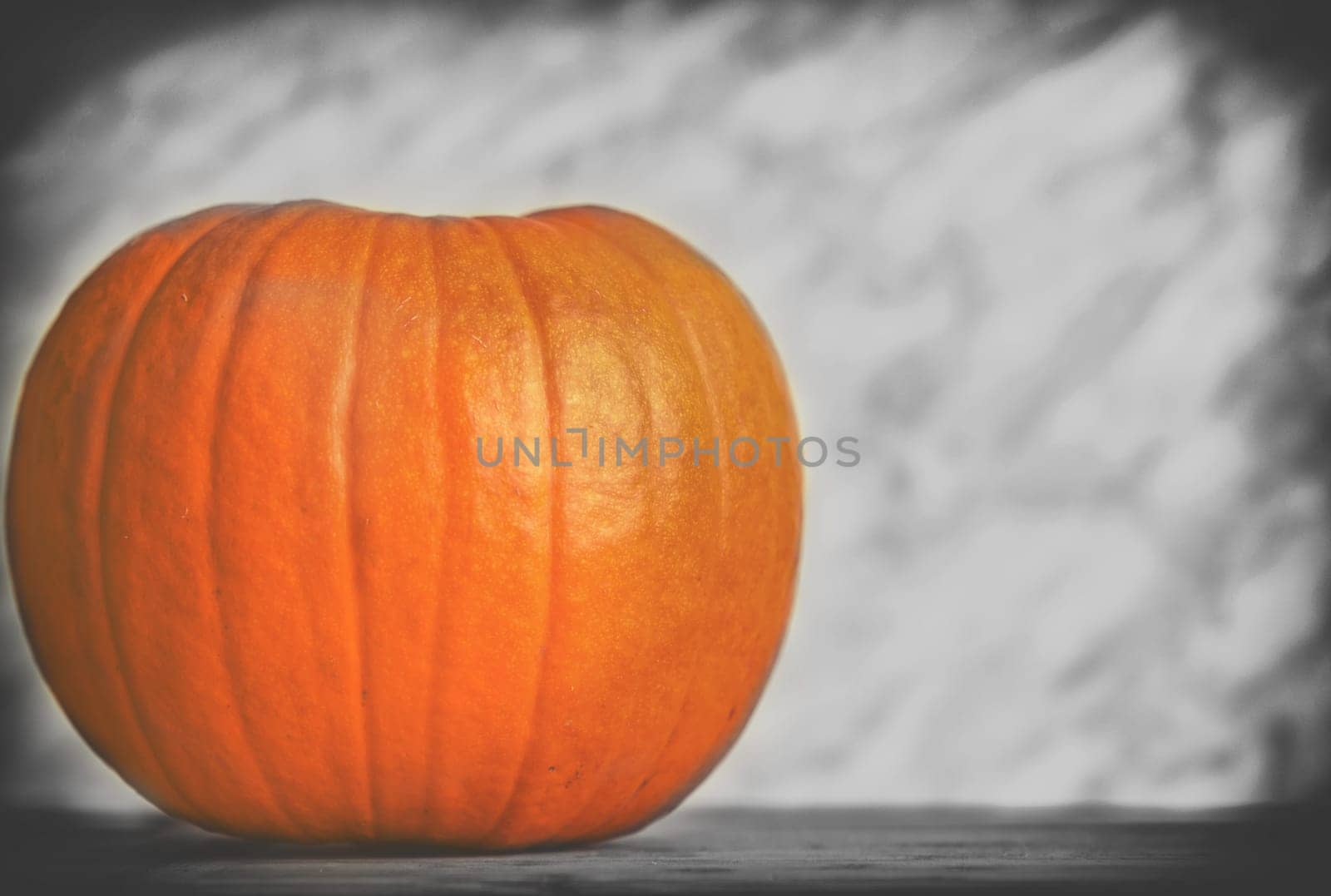 close up on pumpkin on wood and dark background,selective color
