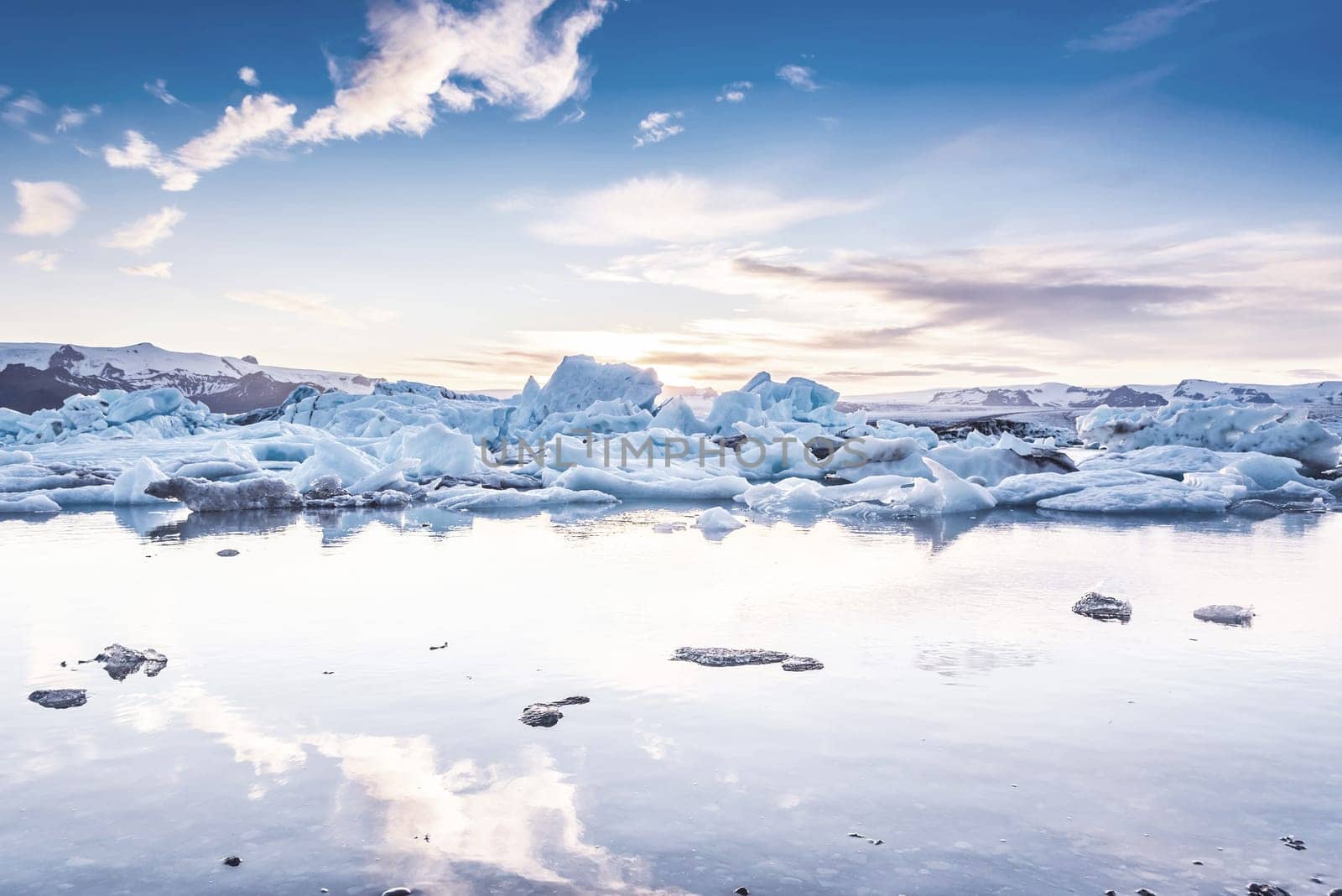 Scenic view of icebergs in Jokulsarlon glacier lagoon, Iceland, at sunset, selective focus, cool vintage style effect