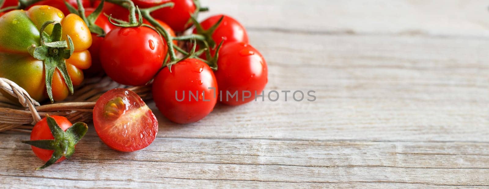 Fresh tomatoes on a wooden table close up