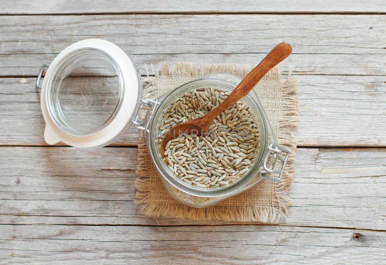 Dry Raw Rye Grain in a jar with a spoon
