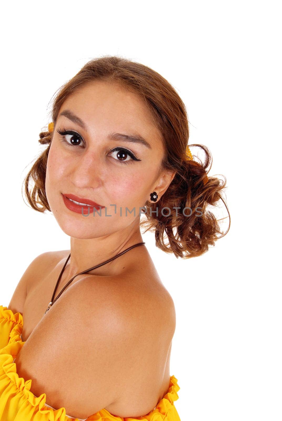 A profile portrait of a gorgeous young woman in a yellow blouse with.brunette hair, isolated for white background..