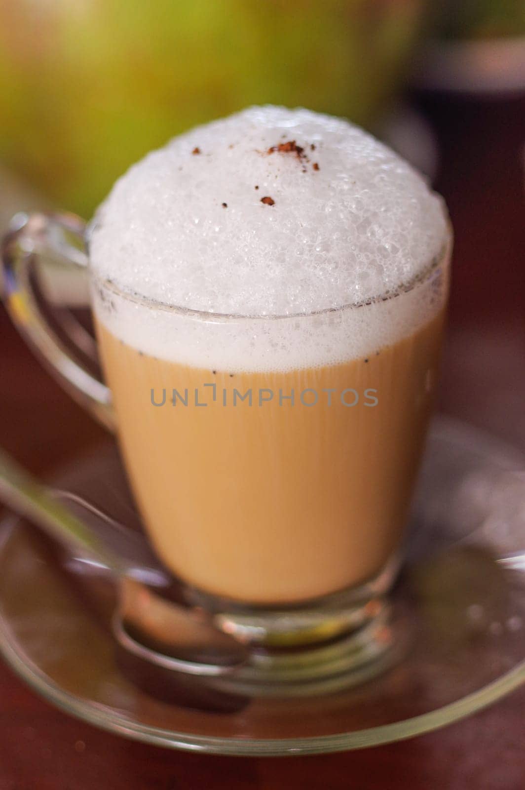 A cup of cappuccino on wooden table