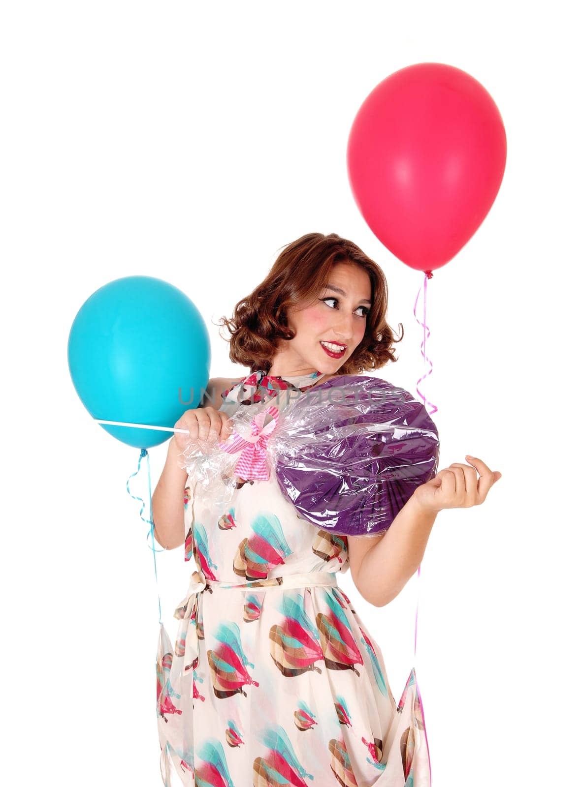 A pretty woman with two balloons and a big lollipop standing closeup.isolated for white background..