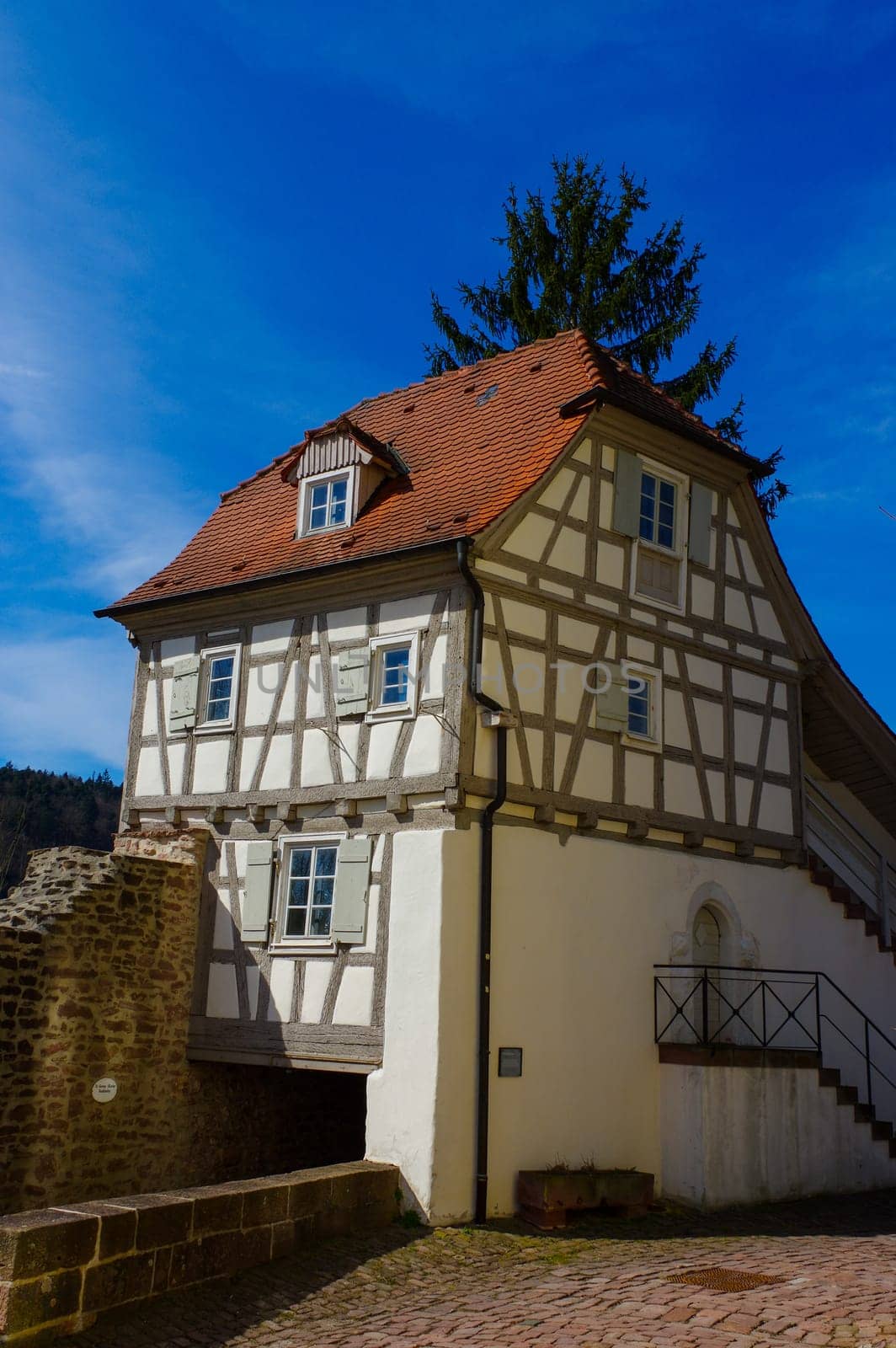 Residential tudor style house , with blue sky in background. Castle Neuenb rg in Germany.