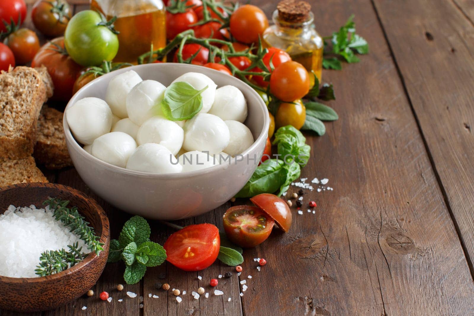 Italian food ingredients for caprese salad on wooden background